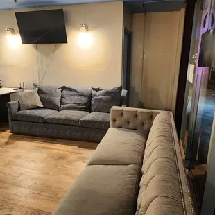 a living room with couches and a television