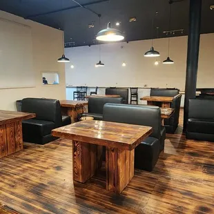 a wooden table and couches