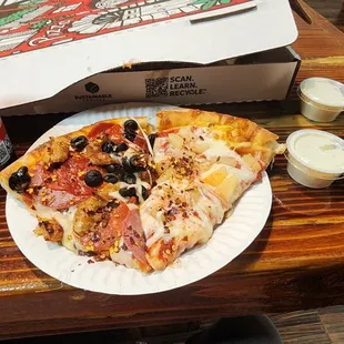 a slice of pizza and a soda