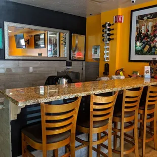 a counter and chairs