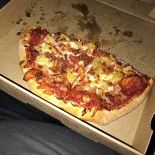 a slice of pizza in a box
