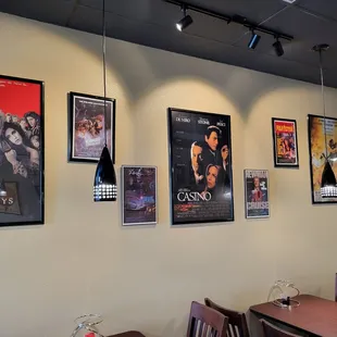 a row of movie posters on the wall