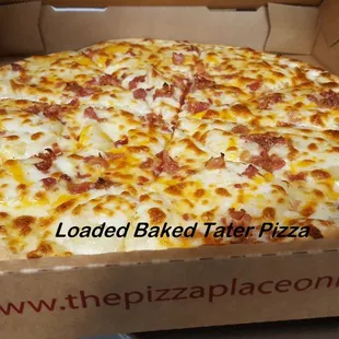 a pizza in a cardboard box