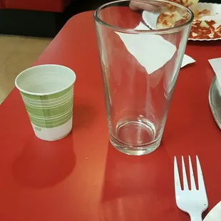 &quot;water cup&quot;. Next to a normal sized beer mug for scale. Essentially holds 1-2 sips of water. Neat.