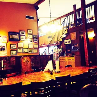 a dining area with tables and chairs