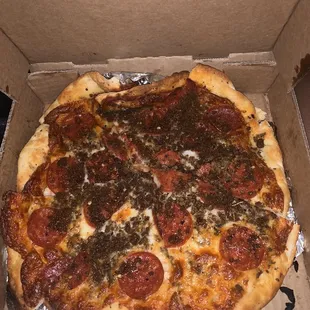 a pepperoni pizza in a box