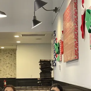 Stacked pizza boxes on every trash can....