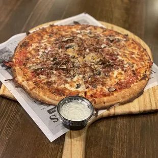 a pizza on a cutting board
