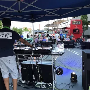 a man standing under an umbrella