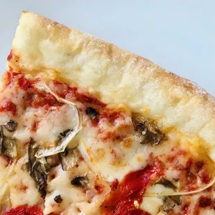 a slice of pizza on a plate