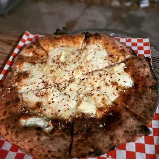 a pizza with cheese on it