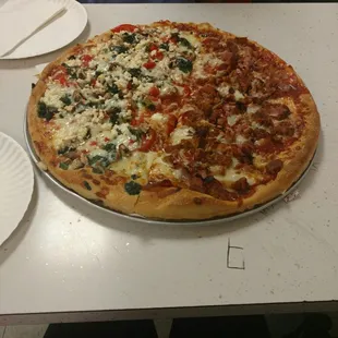 Split veggie &amp; meat pizza