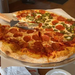 Large pizza all pepperoni half jalapeños