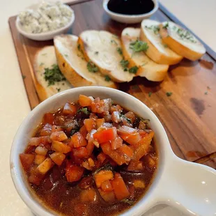 a bowl of soup and bread