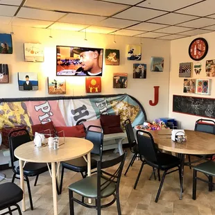 a dining area with tables and chairs