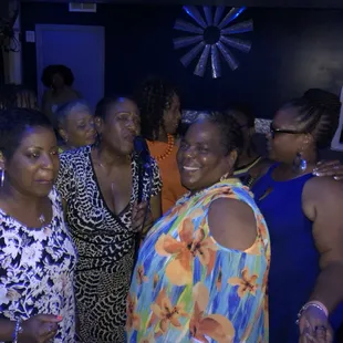 Ladies harmonizing during Slow Jams