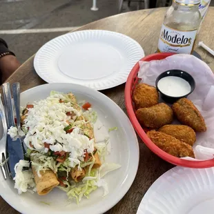 Taquitos and jalapeño poppers