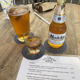 a drink and a menu on a table