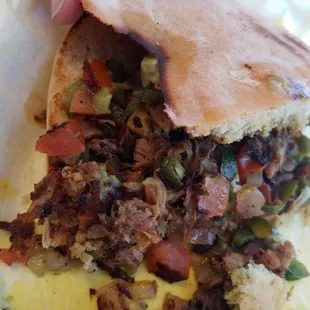 $4.75 Torta de Carne Desebra está mezclada con jalpenos cebolla y tomates picada está bueno pero le falta frijol o mayonesa en el pan