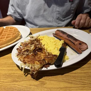 Waffle breakfast with polish sausage.