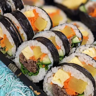a tray of sushi rolls