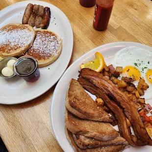 two plates of breakfast food