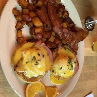 Eggs Benedict with a side of bacon