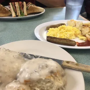Biscuits n gravy (foreground), club sandwich (background)