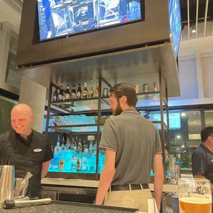 Quiet cheerful sports bar tv.