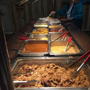a buffet with a variety of food items