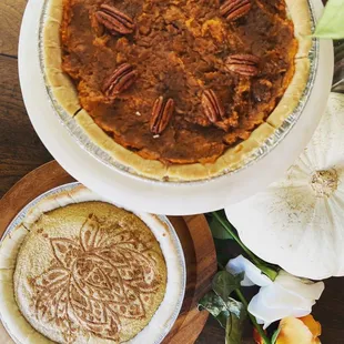 Pumpkin pie cheesecake and sweet potato pecan pie for Thanksgiving dinner.