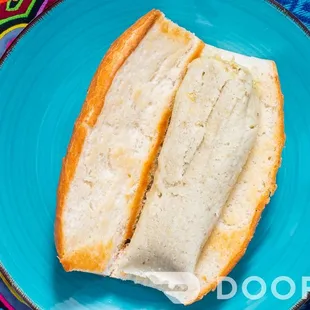 a sandwich on a blue plate