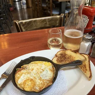 The Irish Skillet; hash brown potatoes, pico, chicken sausage &amp; eggs the way you want them with a side of sourdough. Peach mimosa caraf