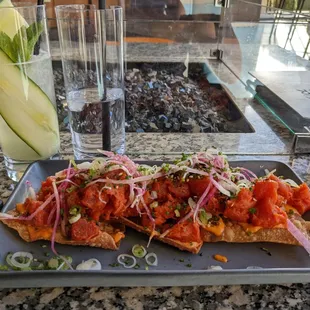 a plate of food and a glass of water