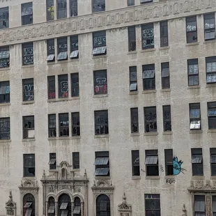 I'm just curious how they got graffiti on the outside of the windows. Building across the street from the plaza deli.