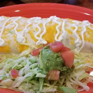 Beef Grande Enchilada with sour cream.