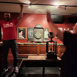 Dartboard and championship darts players