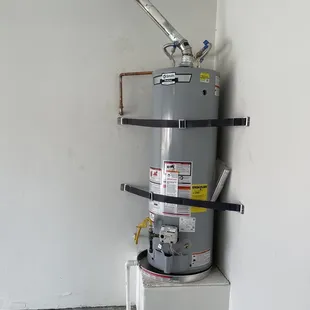 Water heater replacement. Securely strapped .