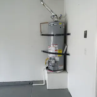 Water heater replacement. Securely strapped