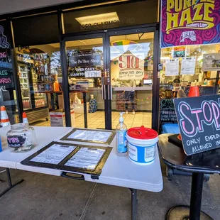 Outside. Storefront. Under the white tent. It&apos;s takeout-only during the current COVID-19 crisis. Very responsible of them.