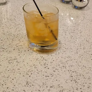 a drink in a glass on a table