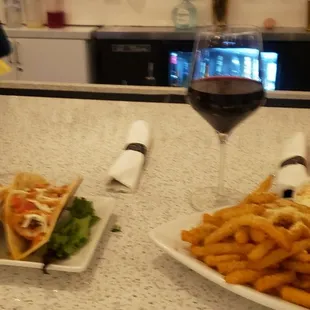 Shrimp Tacos, Truffle Parmesan Fries, Red Blend Wine and I have no idea my BFF drink was.