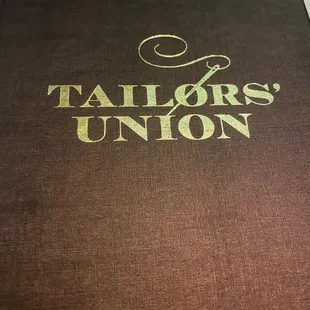 the tailor&apos;s union logo