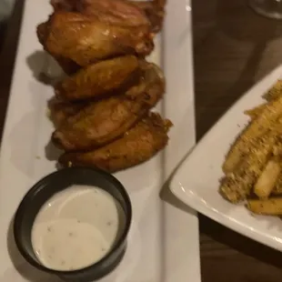 a plate of food and a plate of fries