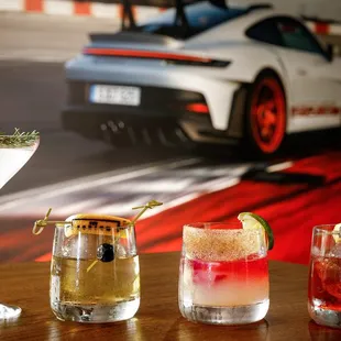 three different cocktails on a table