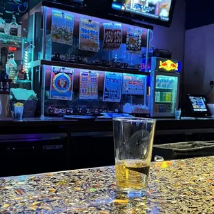 a glass of beer on the bar