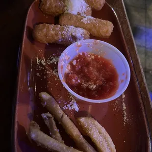 Breaded and Fried Mozzarella Sticks with Marinara Sauce