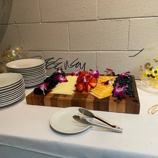 a table with plates, plates, and a cake