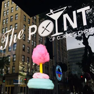 a cupcake in front of a window