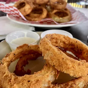 Hand battered onion ring. Absolutely amazing. Delicious. $8. (?)